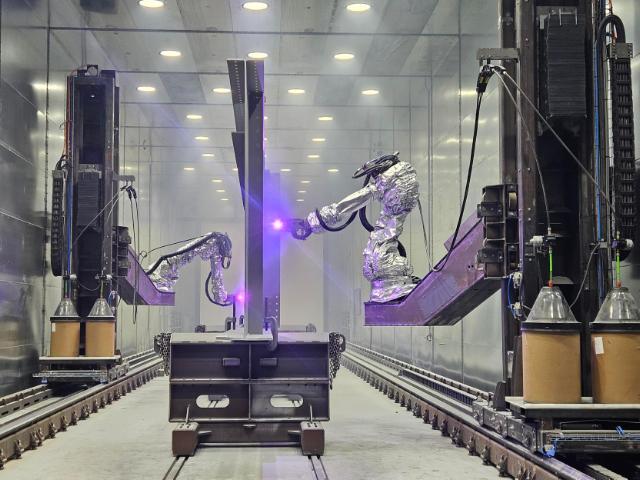 Metallizing within the off shore industry. Metallizing wind turbine tower sections